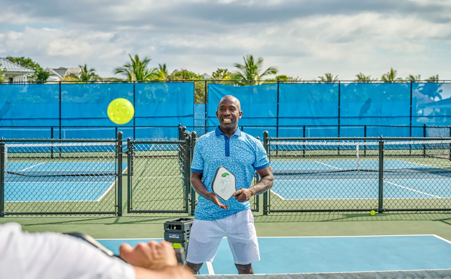 Enthusiastic player enjoying a game of pickleball at The Abaco Club.