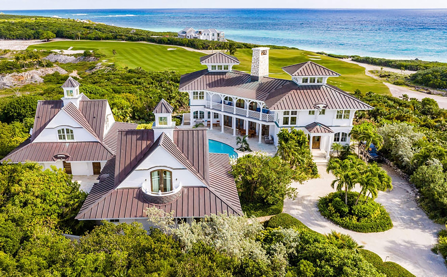Aerial shot of the some of the beachfront houses at The Abaco Club with the Bahamian sea as a background