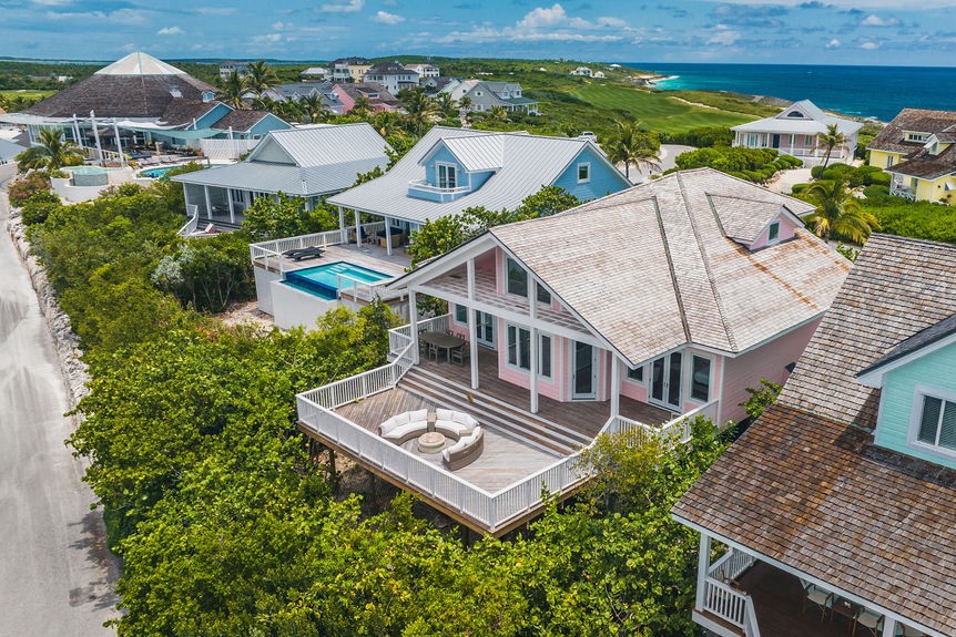 Aerial shot of a pink house at The Abaco Club