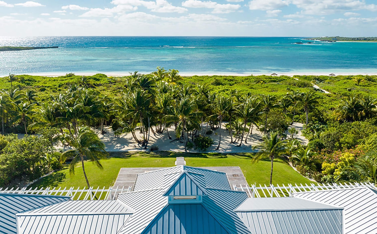 Rooftop view of a property at The Abaco Club overlooking the turquoise Bahamian sea