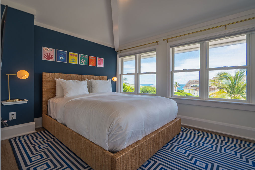 Master Bedroom with a king bed in a beachfront property at The Abaco Club