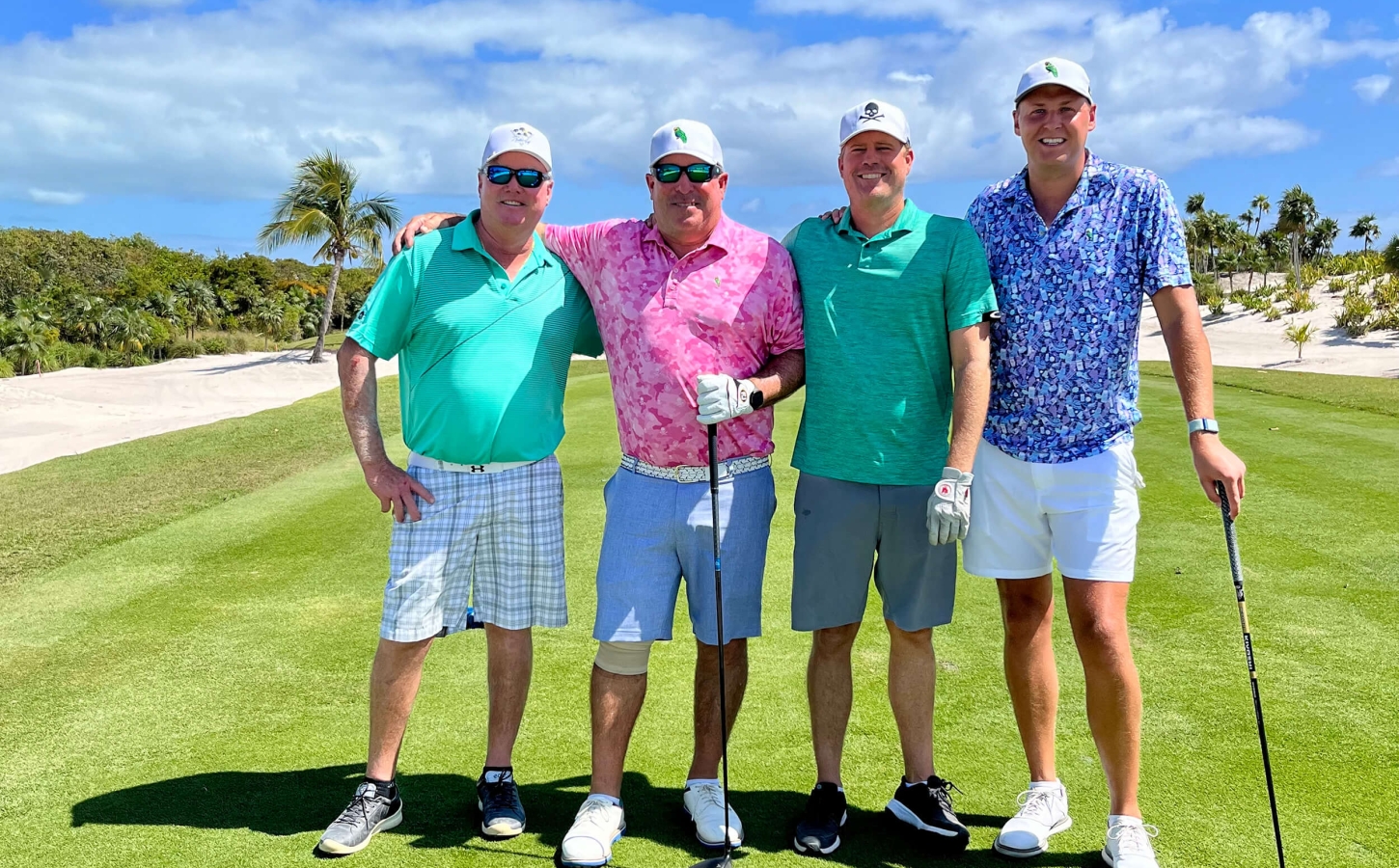 Golf players in colorful attire ready for a game at The Abaco Club, highlighting the exclusive club lifestyle