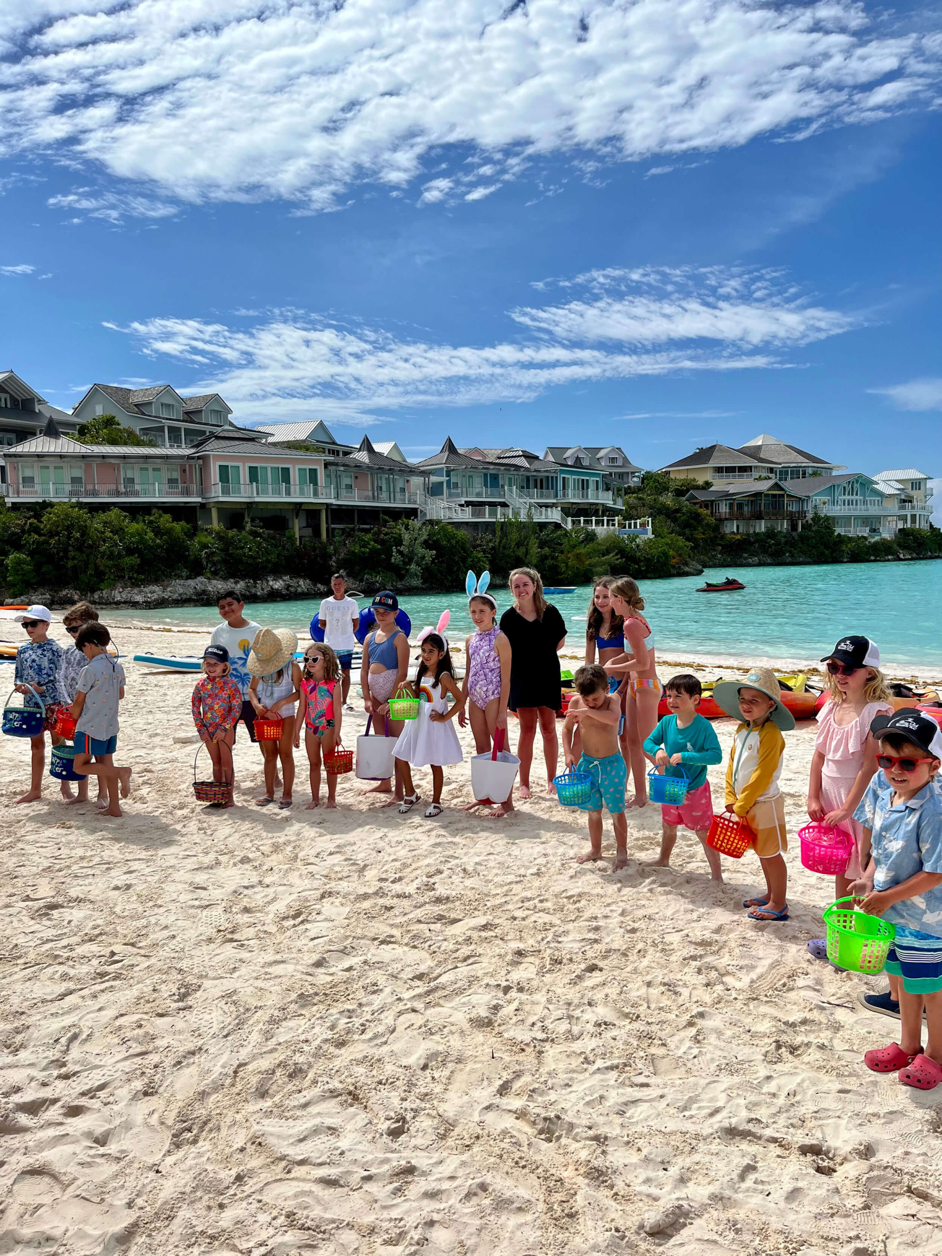 Children participating in a beachside event at The Abaco Club, depicting a vibrant club lifestyle