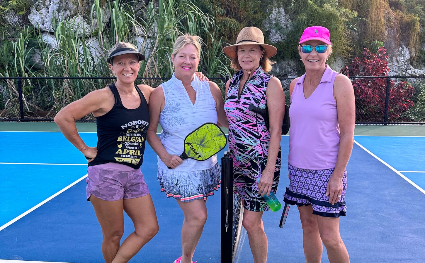 Group of female pickleball players at The Abaco Club on a sunny day, representing active coastal living