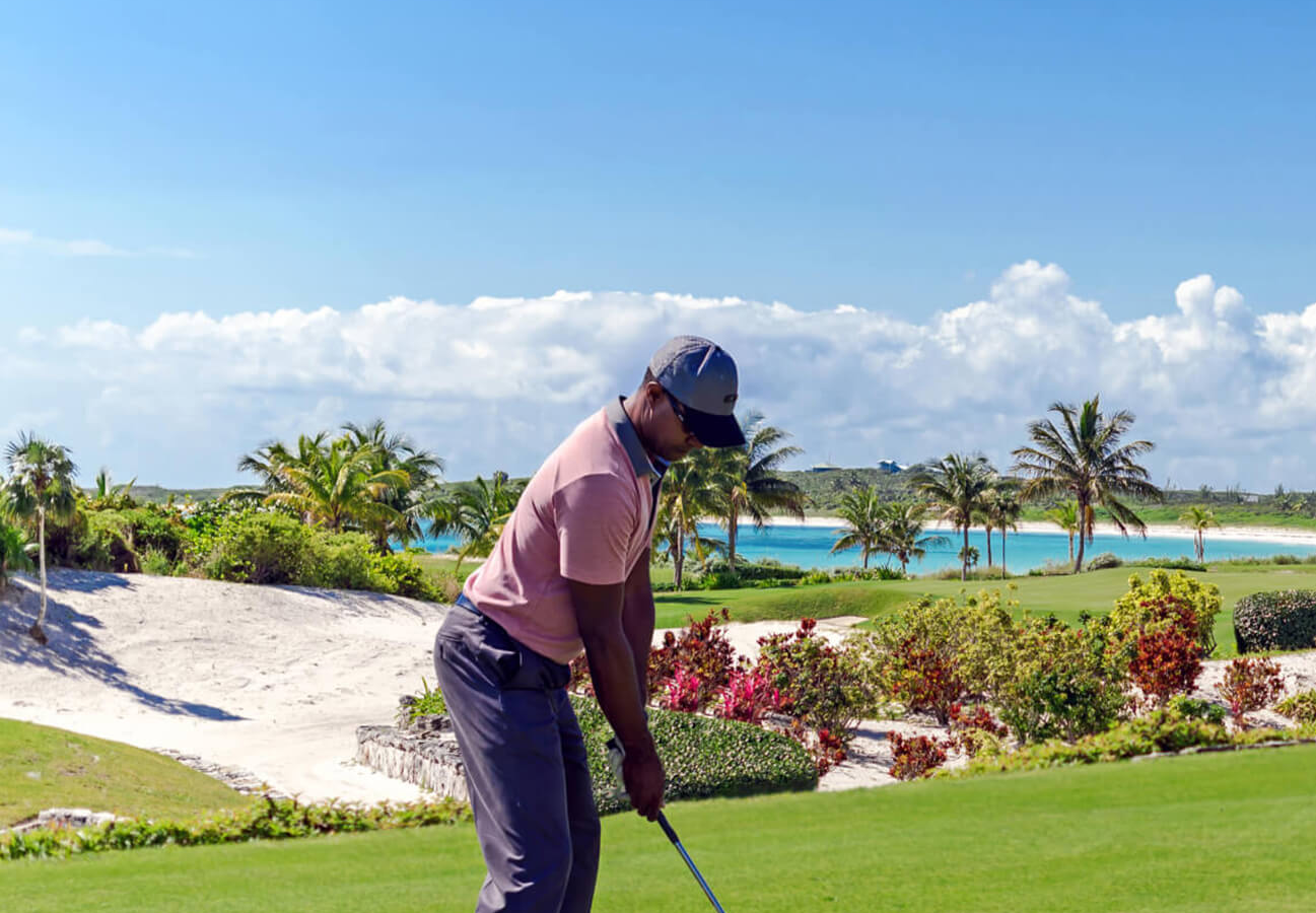 Golfer at The Abaco Club Golf Course about to swing