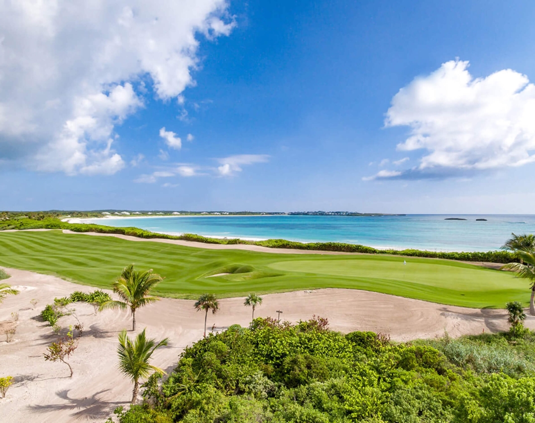 The Abaco Club golf course and the Bahamian coast as a background