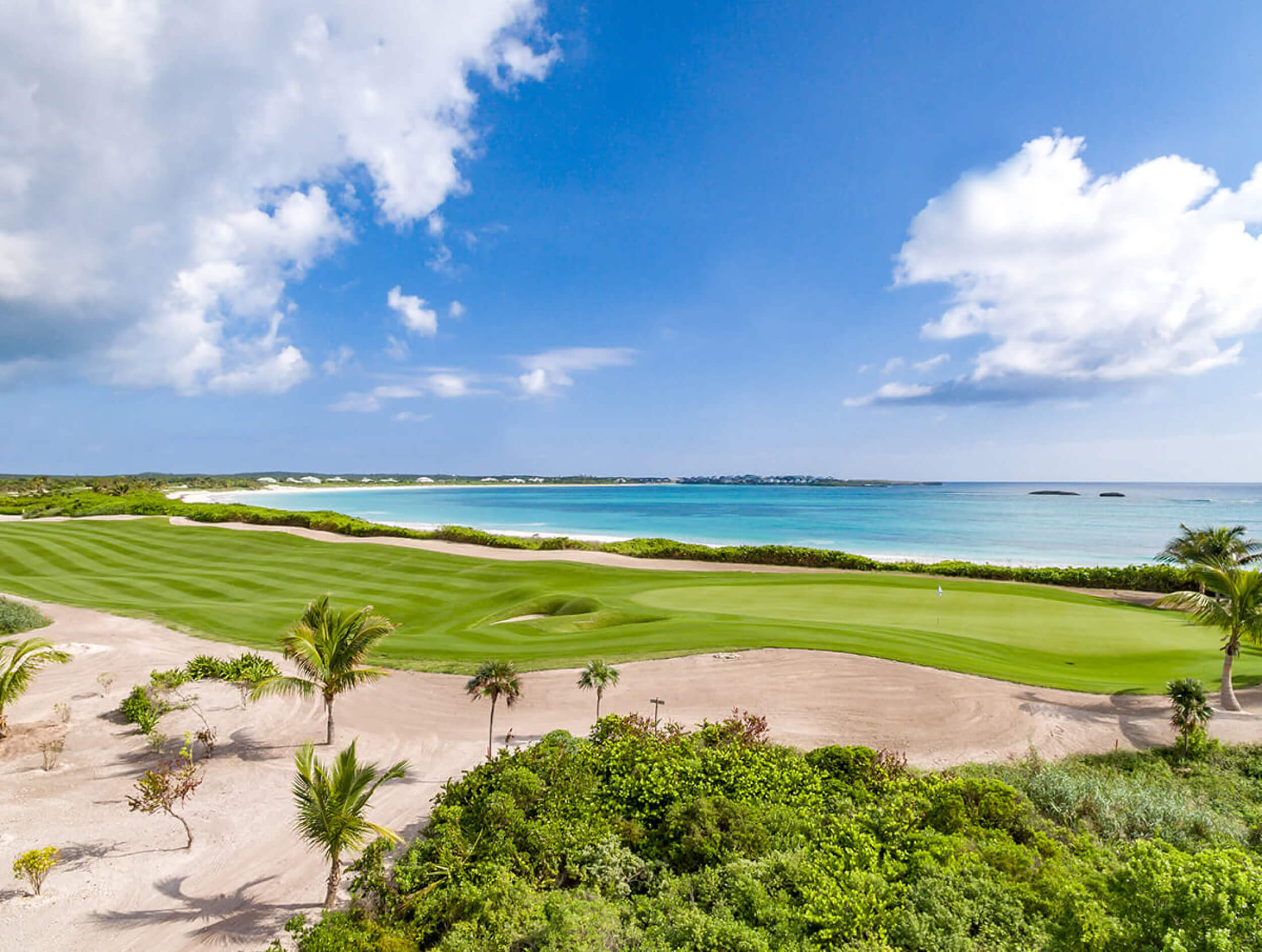 The Abaco Club golf course and the Bahamian coast as a background