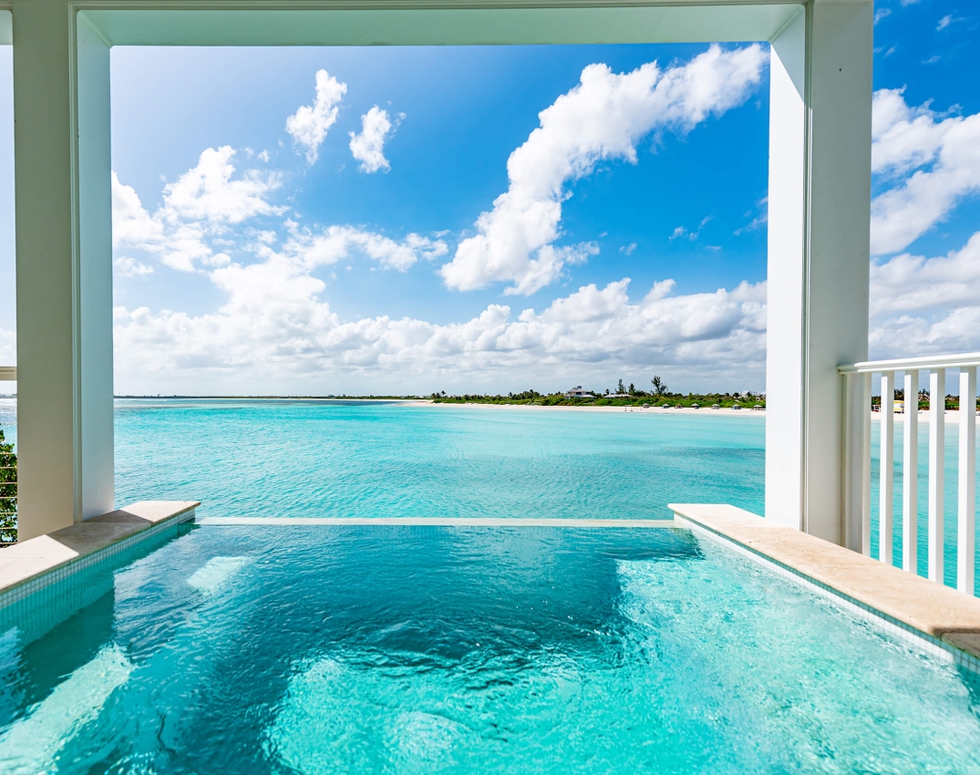 Infinity pool overlooking the turquoise sea at The Abaco Club, capturing the essence of luxurious coastal living