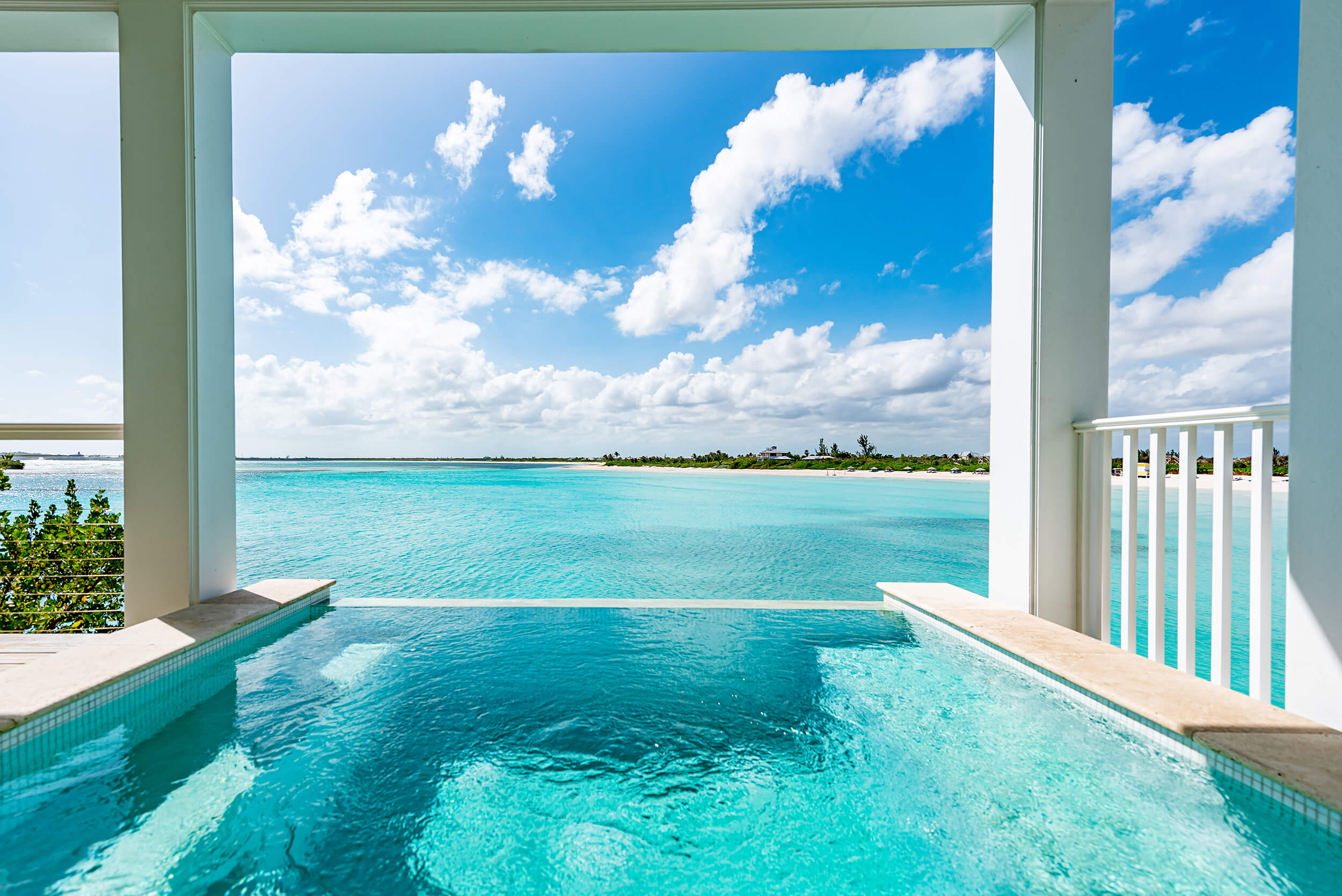 Infinity pool overlooking the turquoise sea at The Abaco Club, capturing the essence of luxurious coastal living