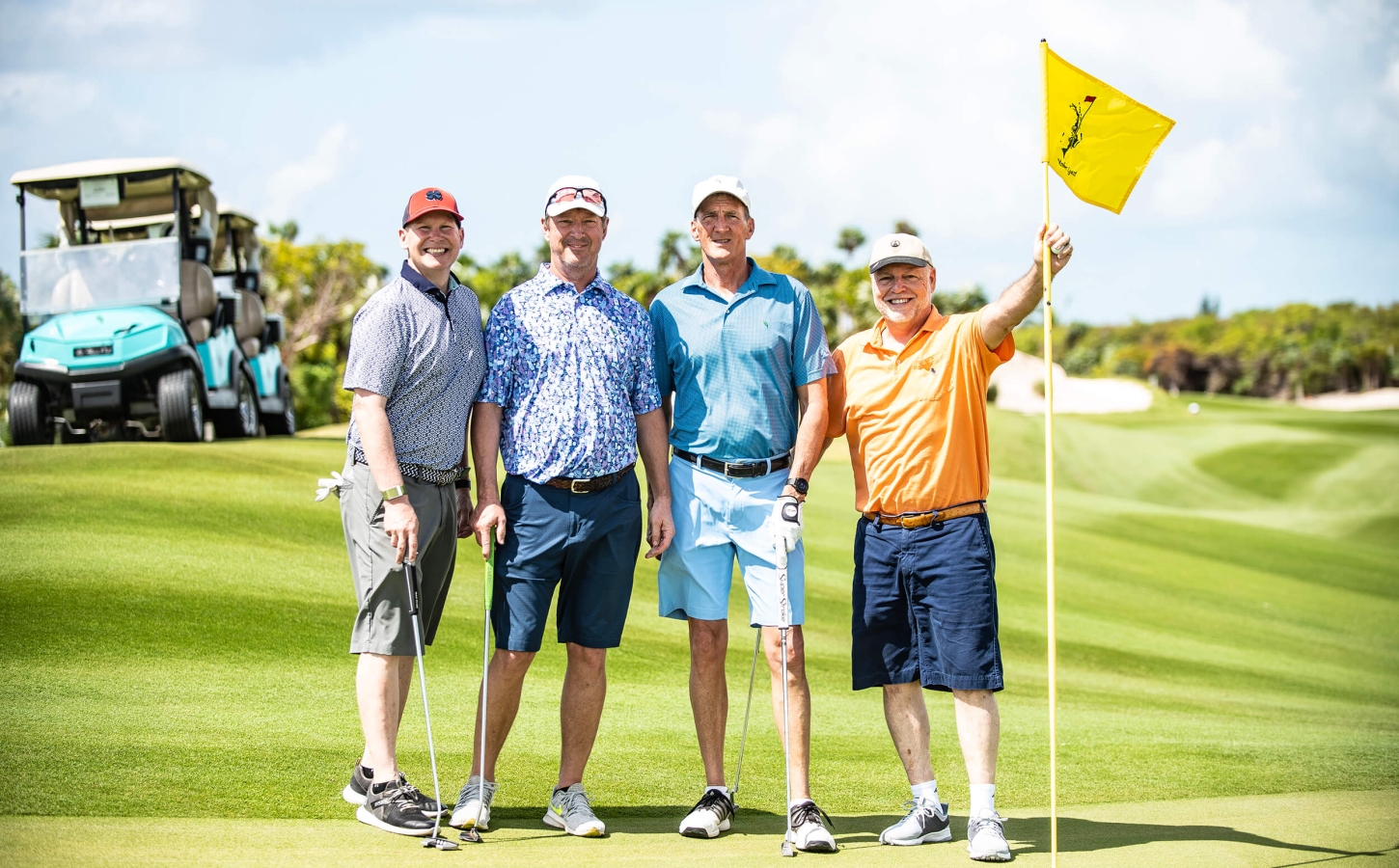 Golf Members posing for a picture at The Abaco Club, encapsulating the club lifestyle.