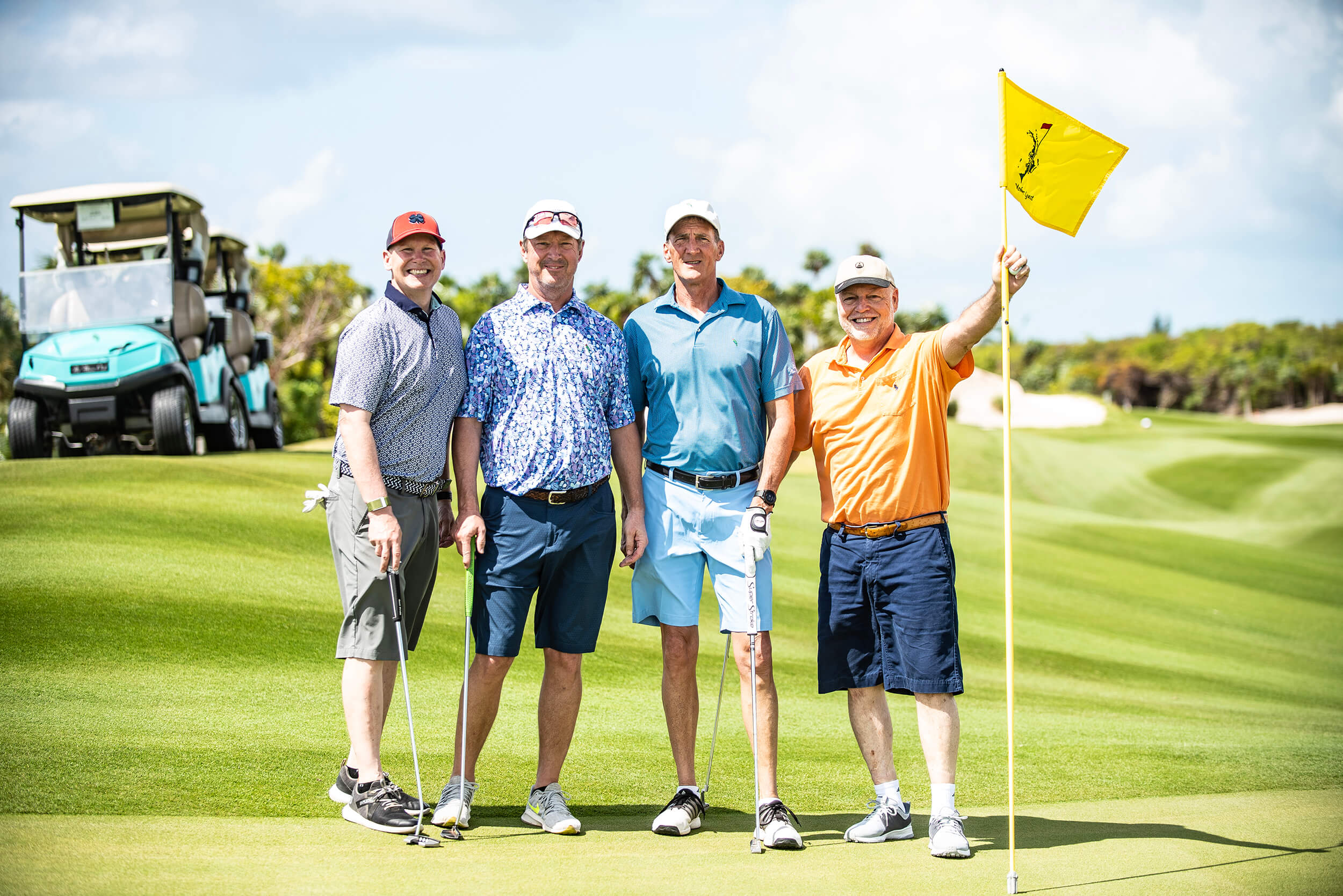 Golf Members posing for a picture at The Abaco Club, encapsulating the club lifestyle.