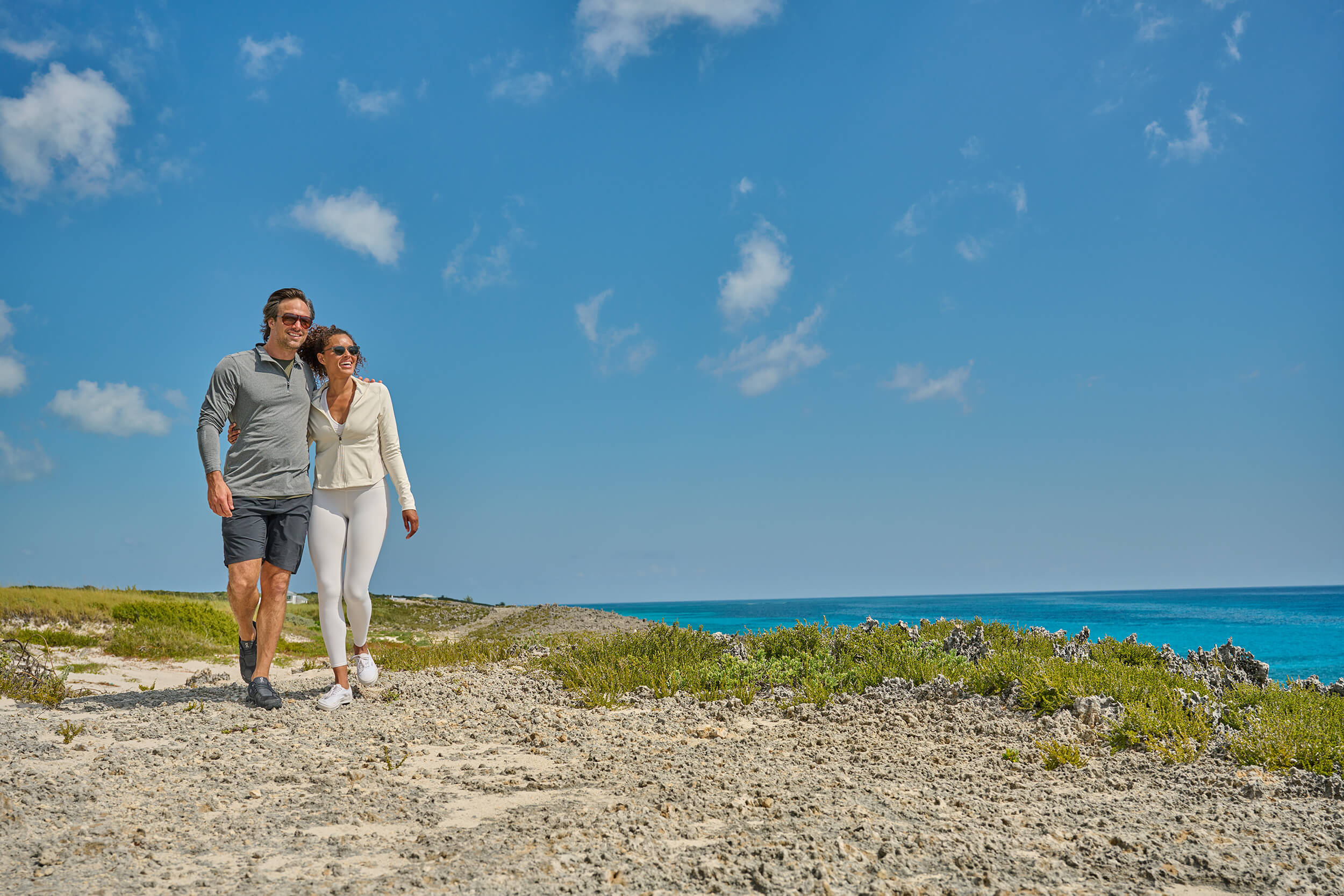 Couple on the beach embodying the romantic club lifestyle at The Abaco Club.