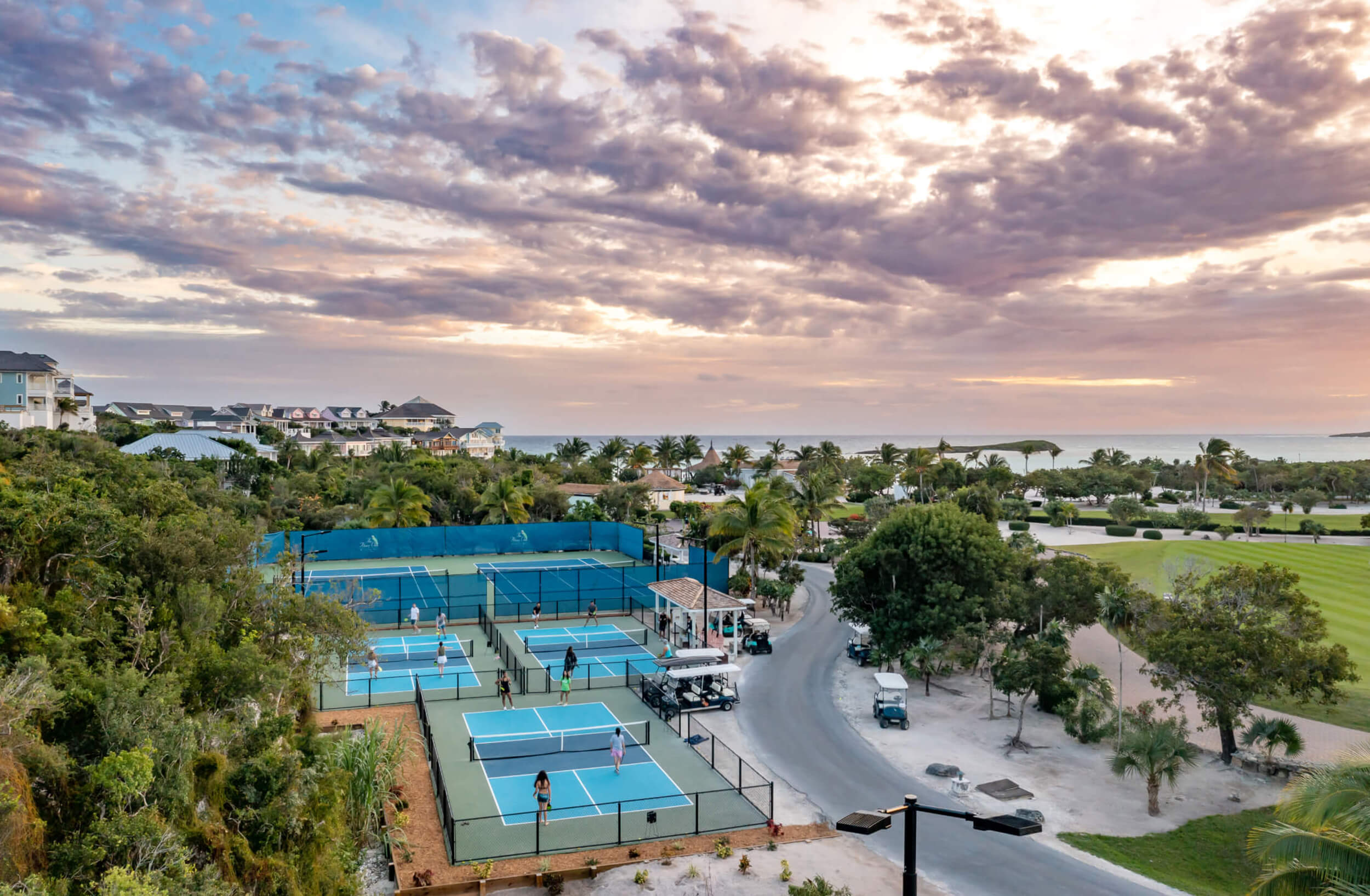 Evening skies over the tennis courts at The Abaco Club, capturing the essence of an active and luxurious club lifestyle