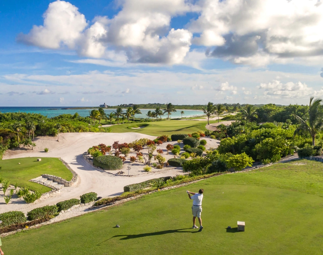 two people golfing at The Abaco Club