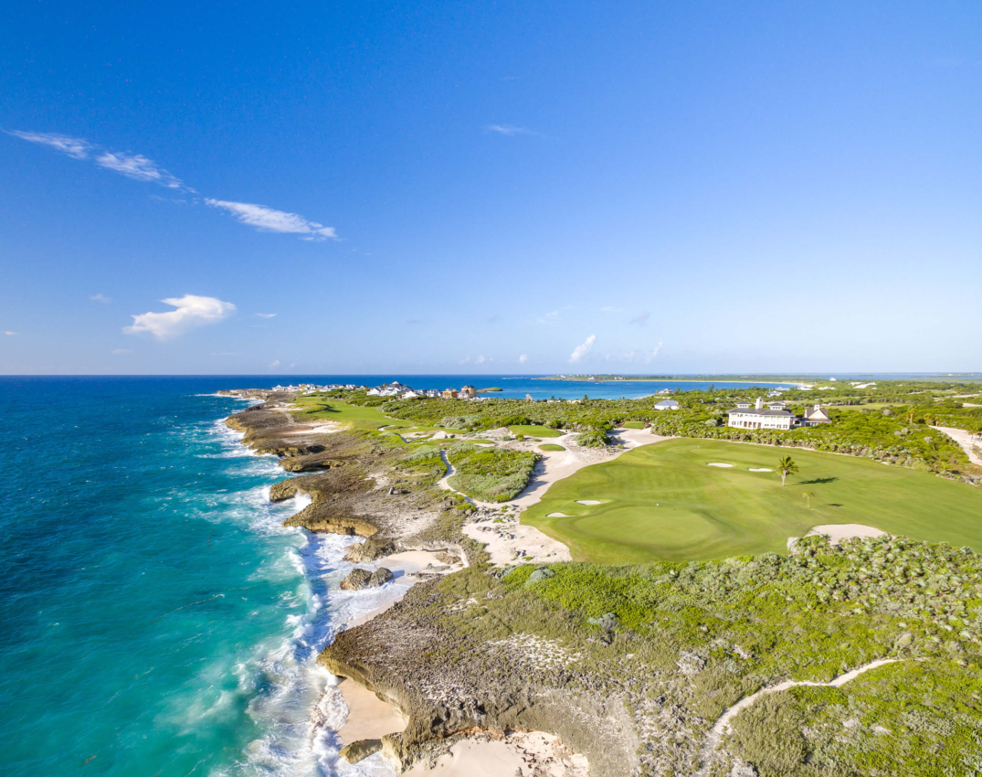 Panoramic aerial shot of The Abaco Club highlighting the golf club's 17th and 18th greens