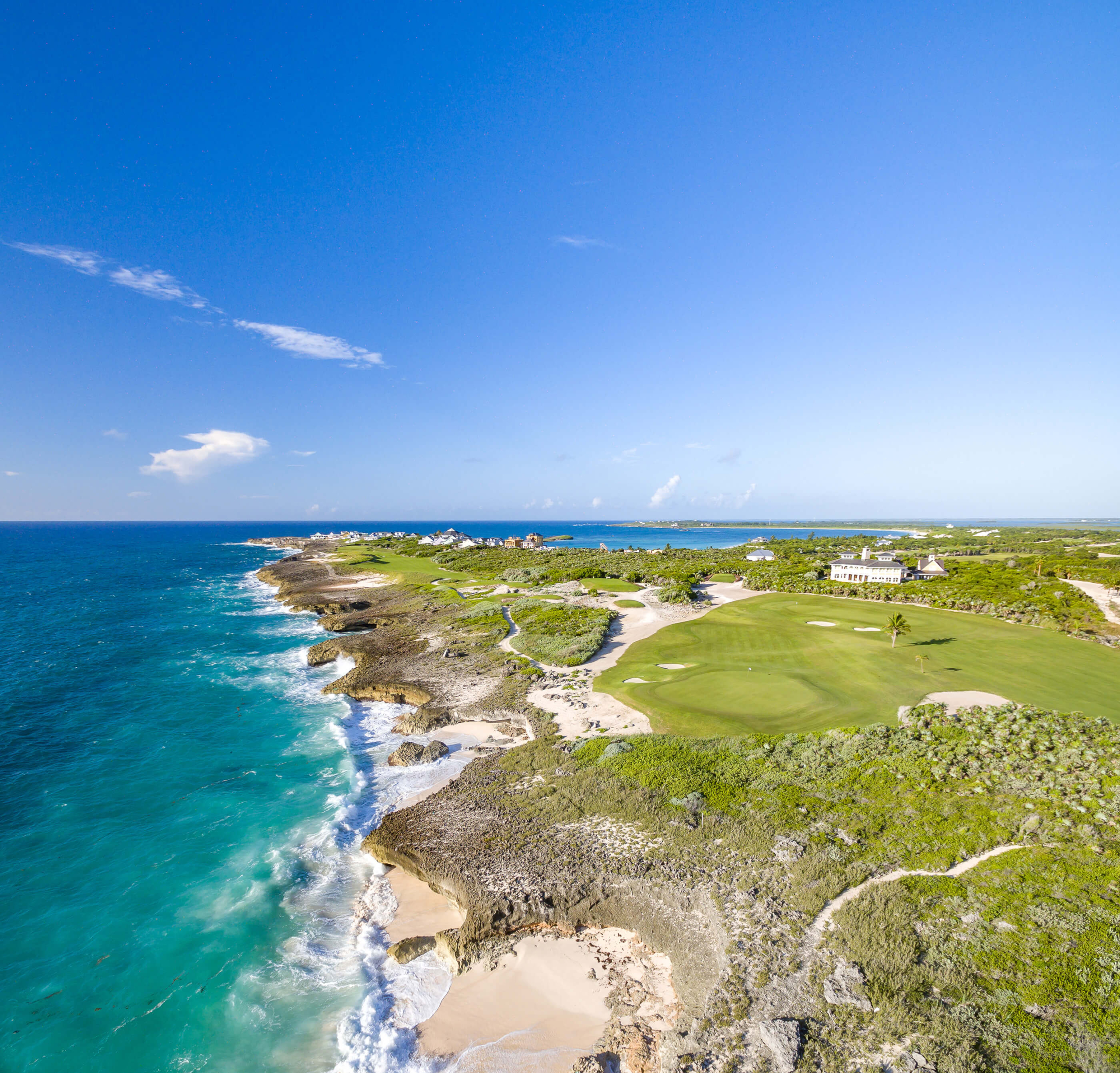 Panoramic aerial shot of The Abaco Club highlighting the golf club's 17th and 18th greens