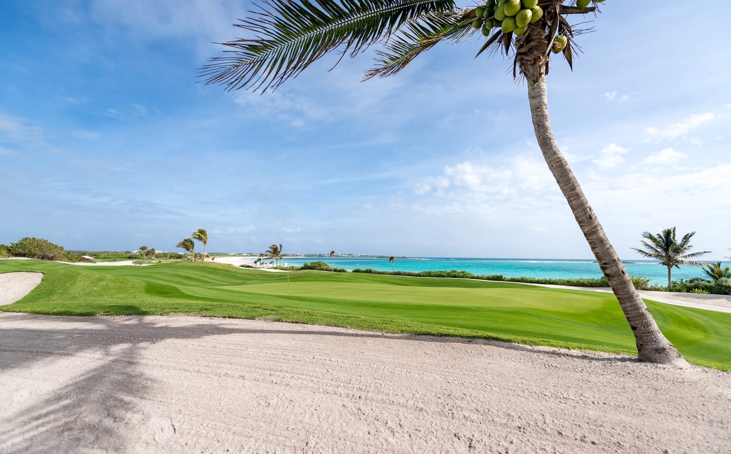 The Abaco Club 5th Green overlooking a tranquil Bahamas sea