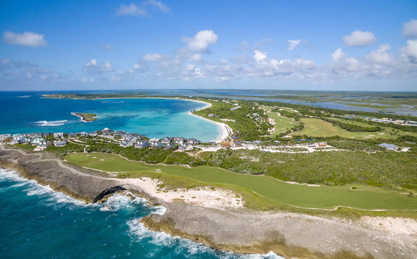 Breathtaking aerial side view of The Abaco Club's shoreline, showcasing the club lifestyle and luxury coastal living in The Bahamas.