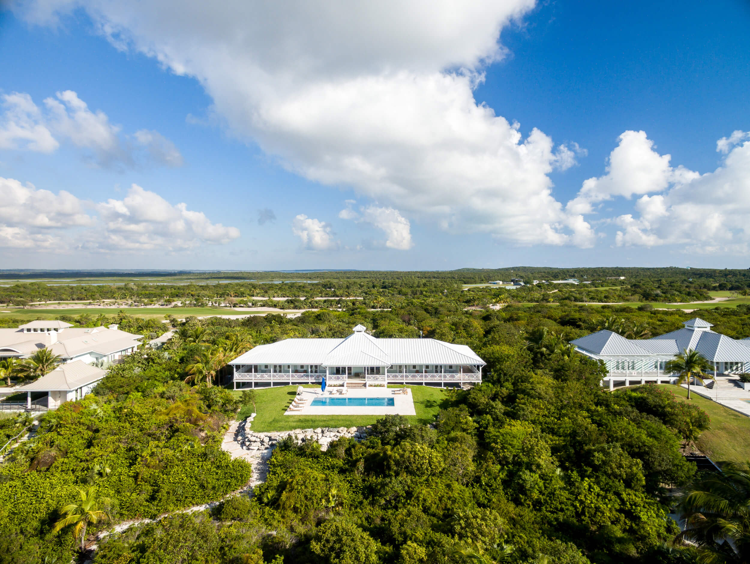 Expansive aerial view of The Estates, a neighborhood in The Abaco Club, nestled in the heart of The Bahamas, offering a pristine example of luxurious coastal living.