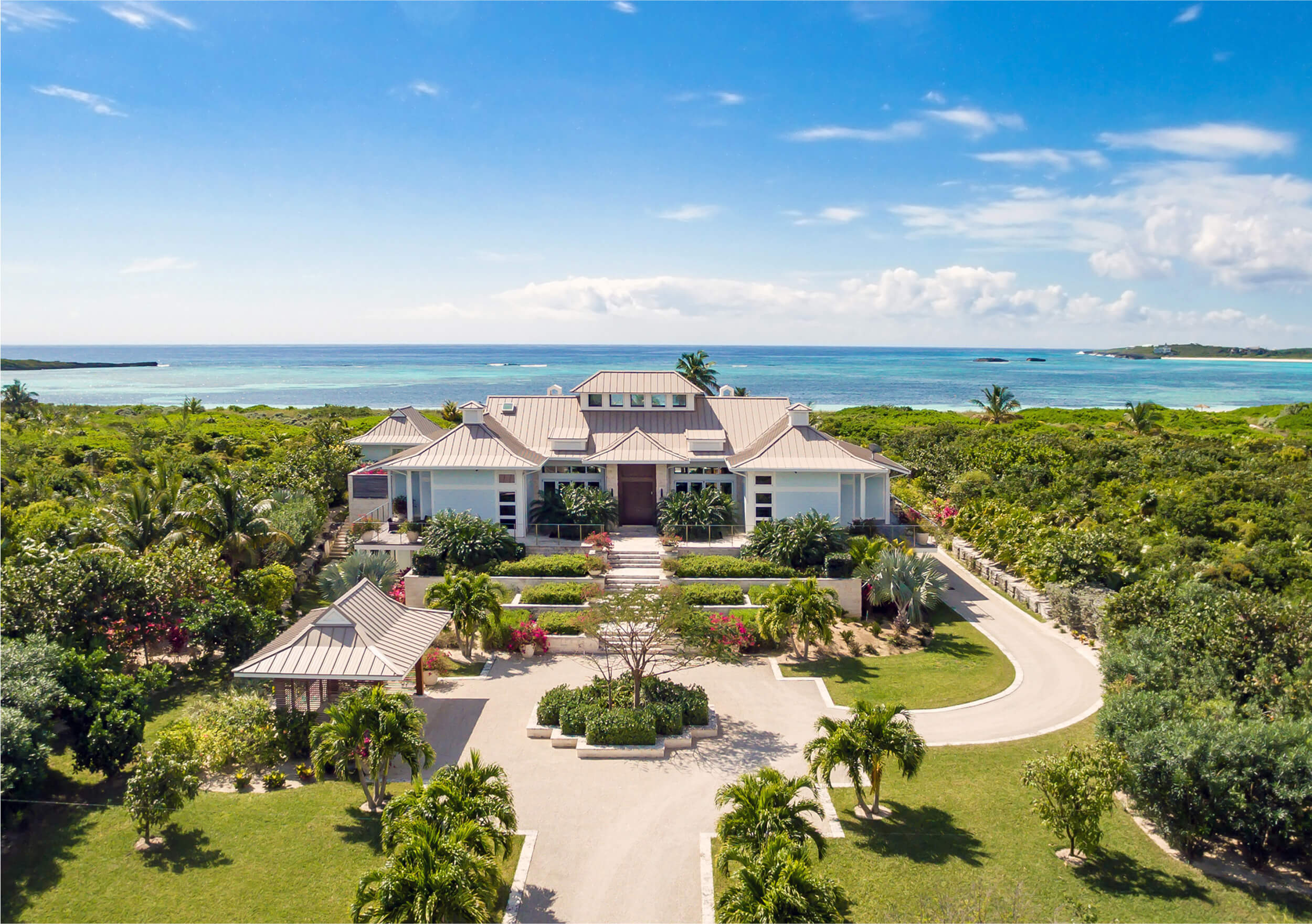 Aerial view of a house in The Estates neighborhood at The Abaco Club surrounded by lush tropical greenery, showcasing the exclusive experience of coastal living in The Bahamas.