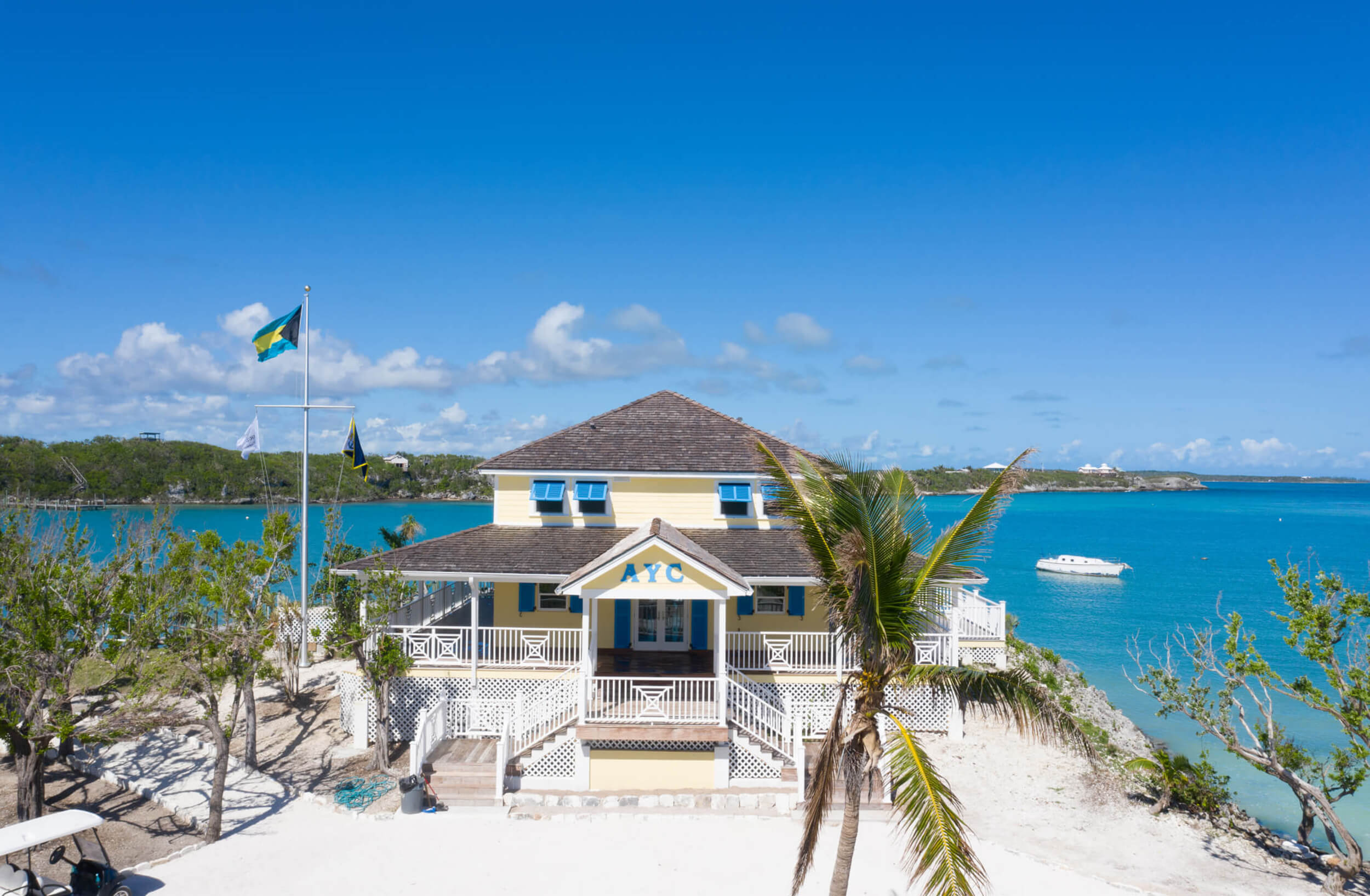 Aerial view of the Abaco yacht club against the backdrop of the crystal-clear Bahamian waters, epitomizing exclusive club lifestyle.