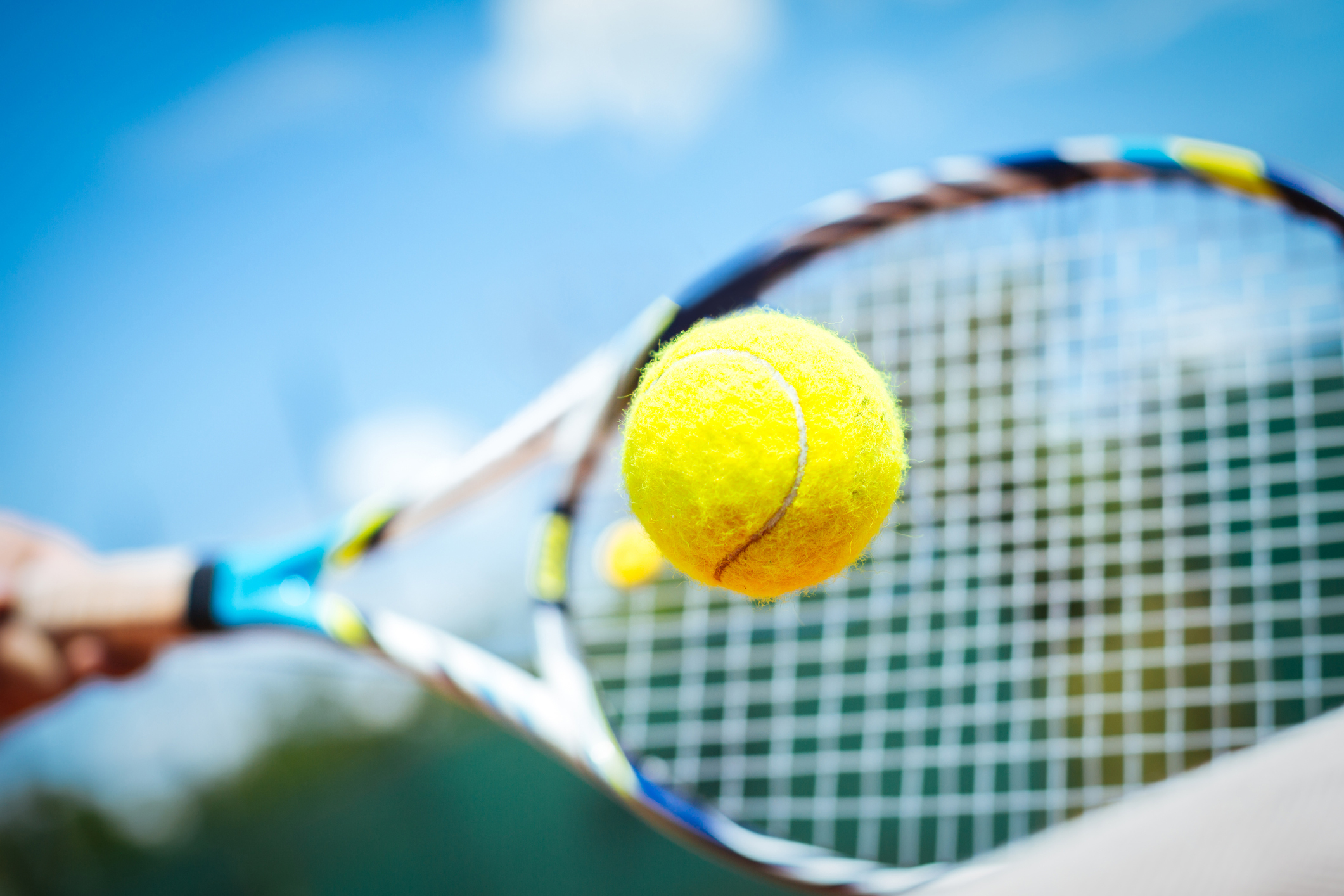 Tennis raquet and ball from The Abaco Club showcasing top notch amenities