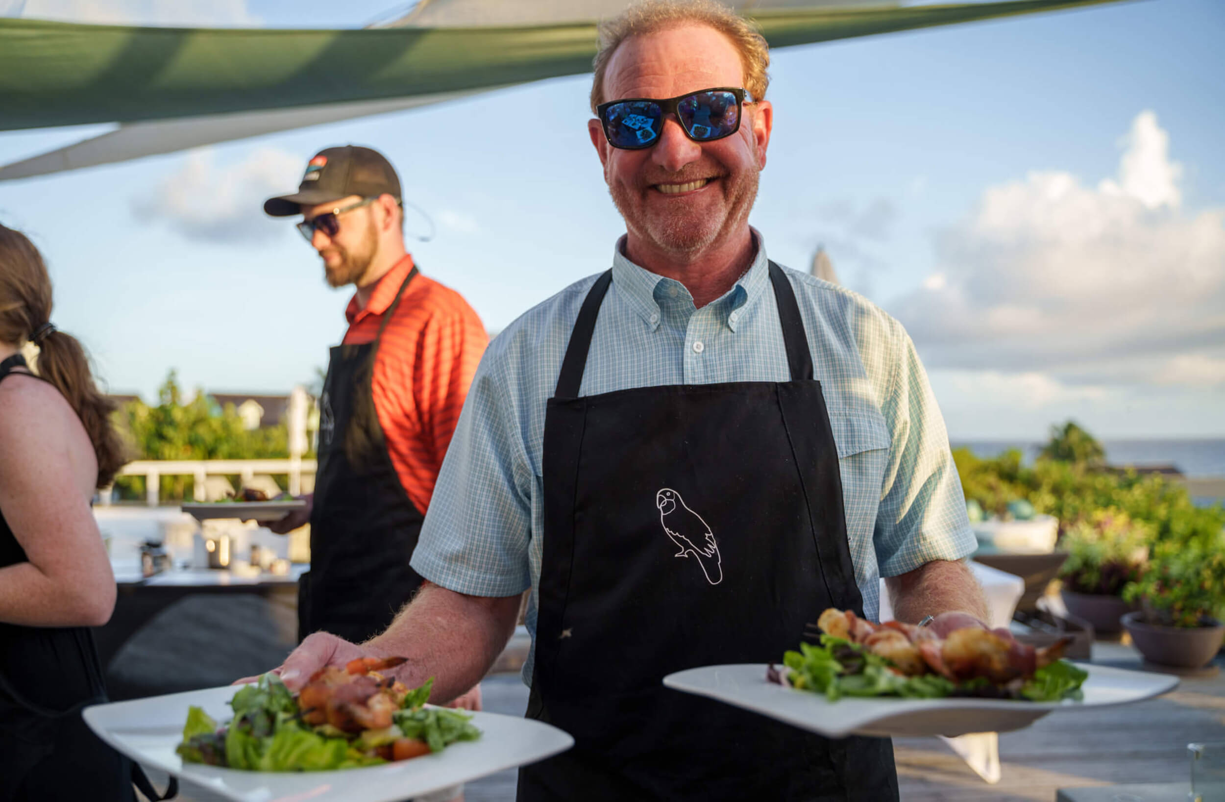 An Abaco Club member enjoying coastal life at a lobster fest event at The Abaco Club