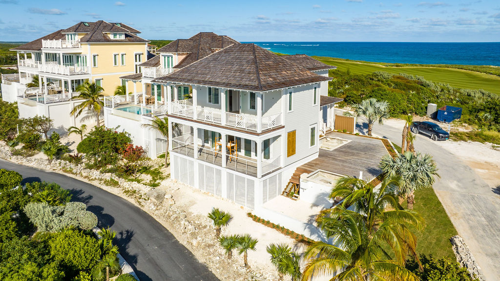 Aerial view of a luxury beachfront villa in The Ridge neighborhood at The Abaco Club