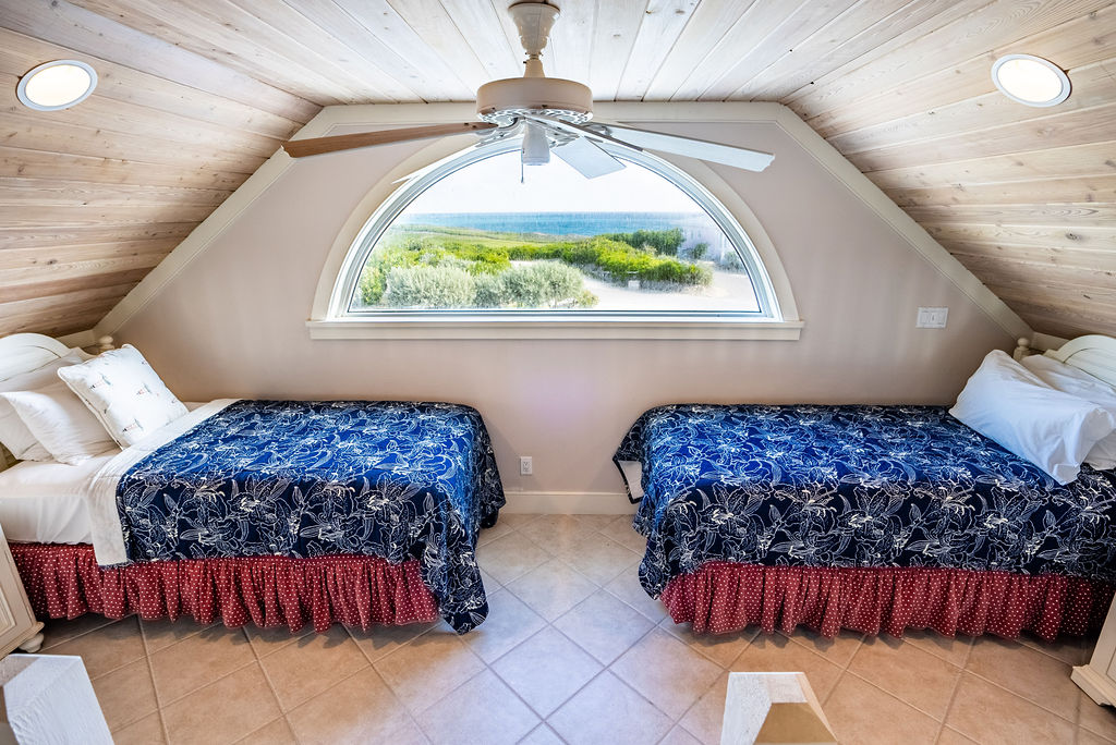 Twin bedroom overlooking the Bahamian sea at The Abaco Club