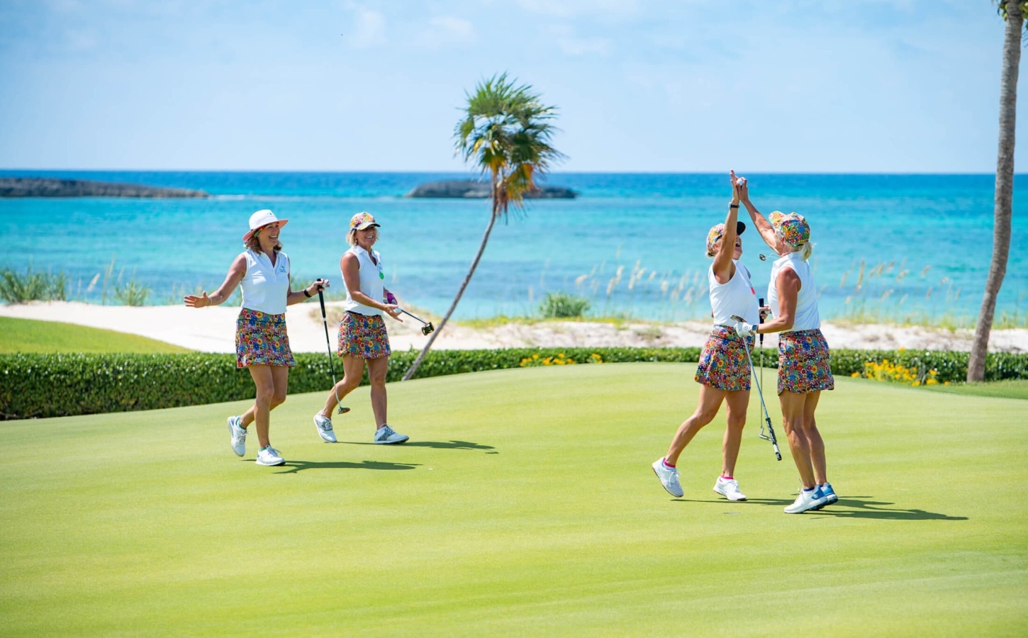 Four women golfing at The Abaco Club Golf Course exemplifying coastal and club life style