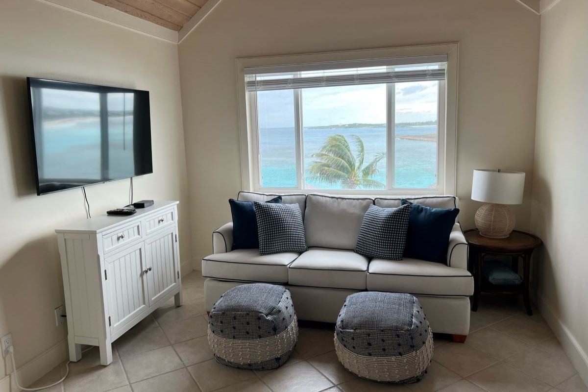 TV room and stunning Winding bay view of a property at The Abaco Club