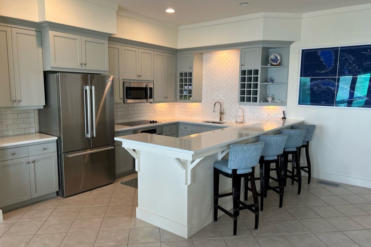Kitchen decorated in white from a beachfront property at The Abaco Club