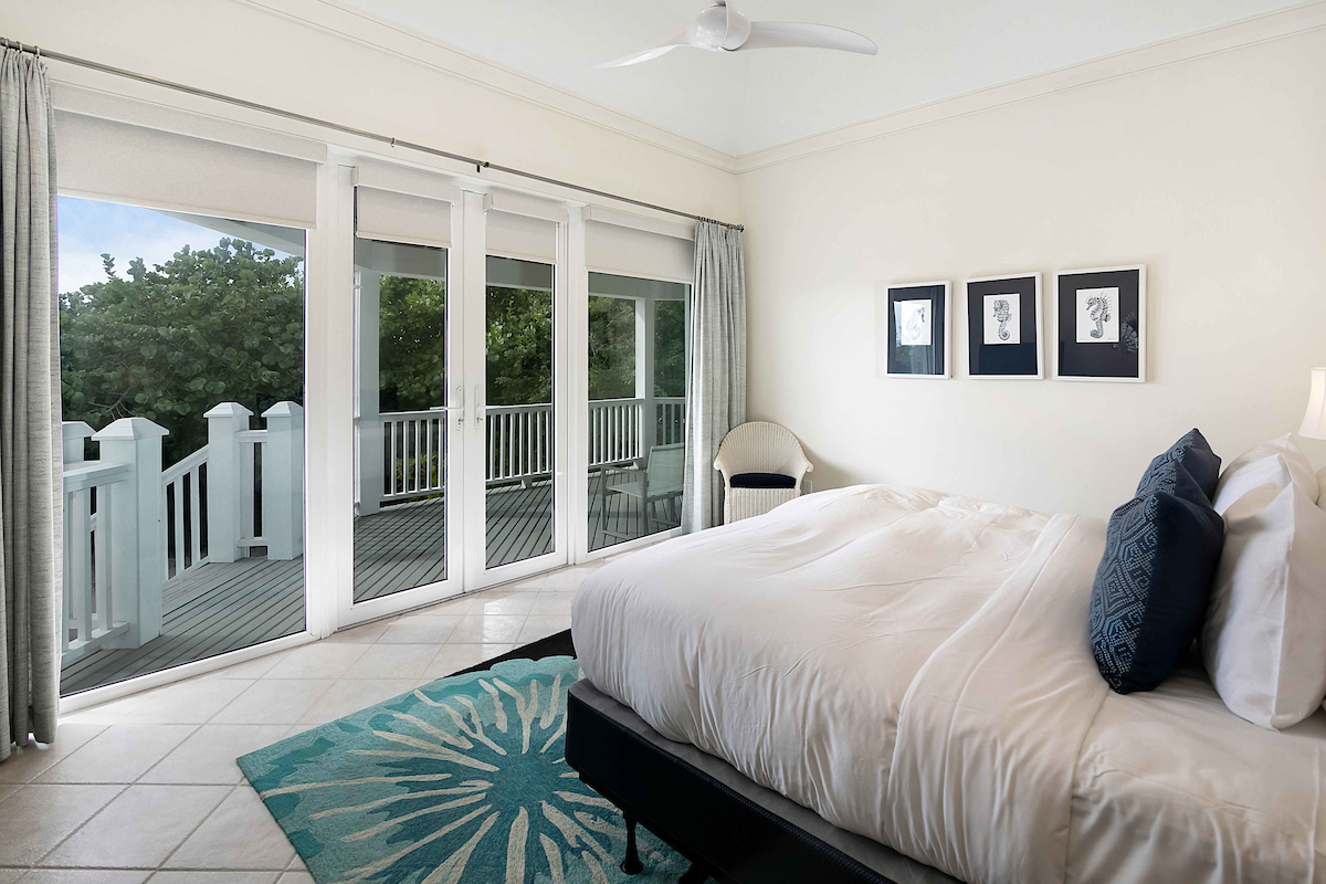 Bedroom with a balcony at The Abaco Club