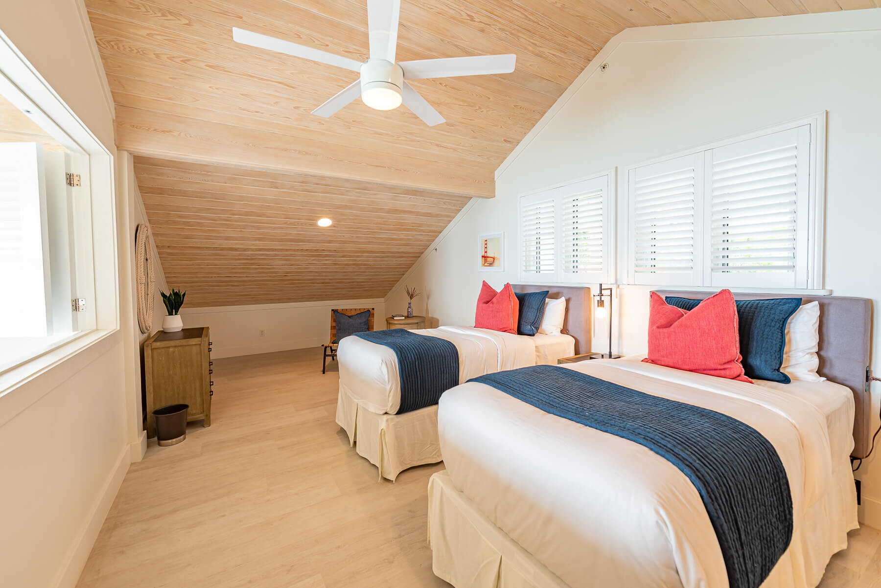 A twin bedroom at The Abaco Club, embodying the tranquil lifestyle of Bahamian coastal living
