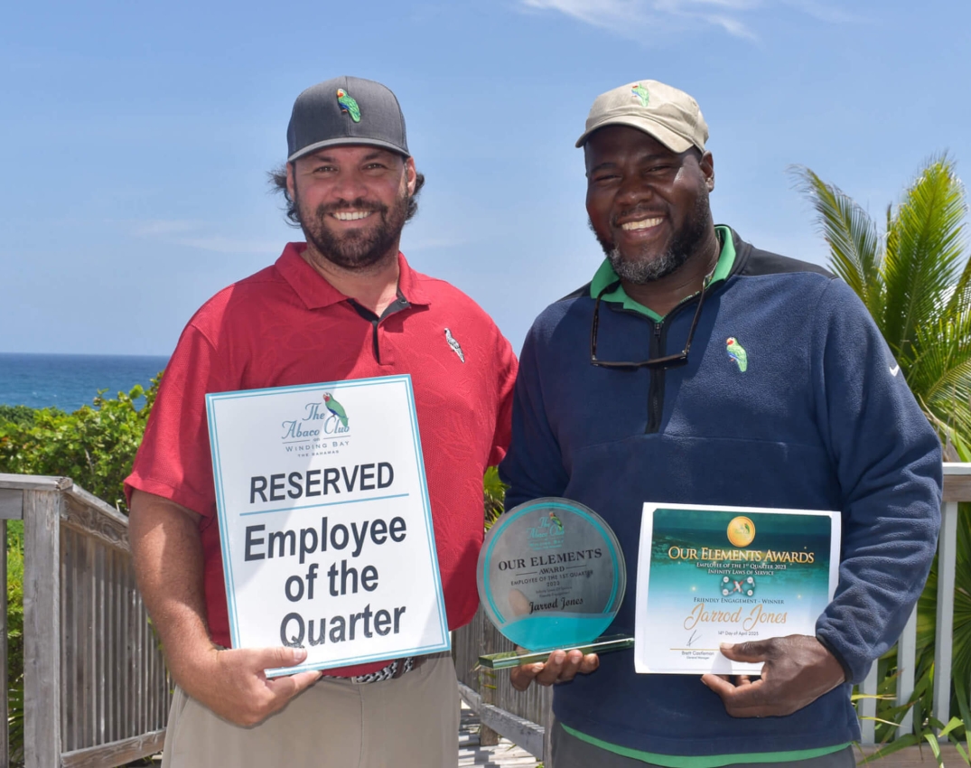 The Abaco Club employees celebrating with awards, embodying the community spirit and club lifestyle in the heart of The Bahamas.