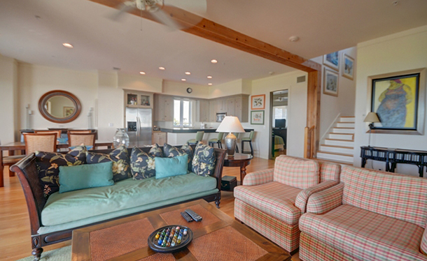 Living room, dining room and kitchen area of the elegant beachfront Three Cheers property in The Abaco Club