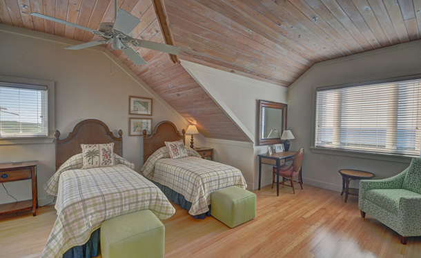 image of a twin bedroom at The Abaco Club with beach style themed decor showing the lifestyle of Bahamian coastal living