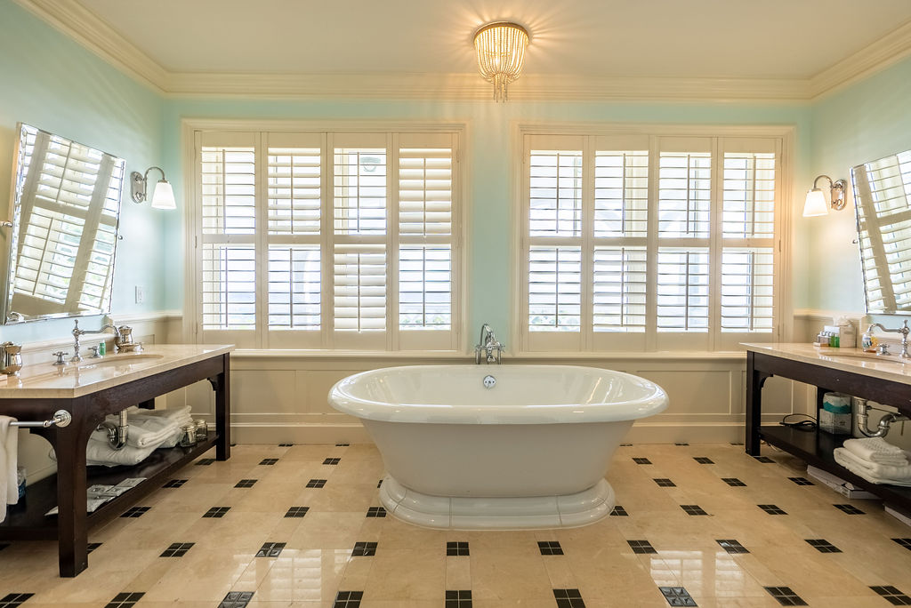 bathroom tub and windows looking at water from a property in the Abaco Club