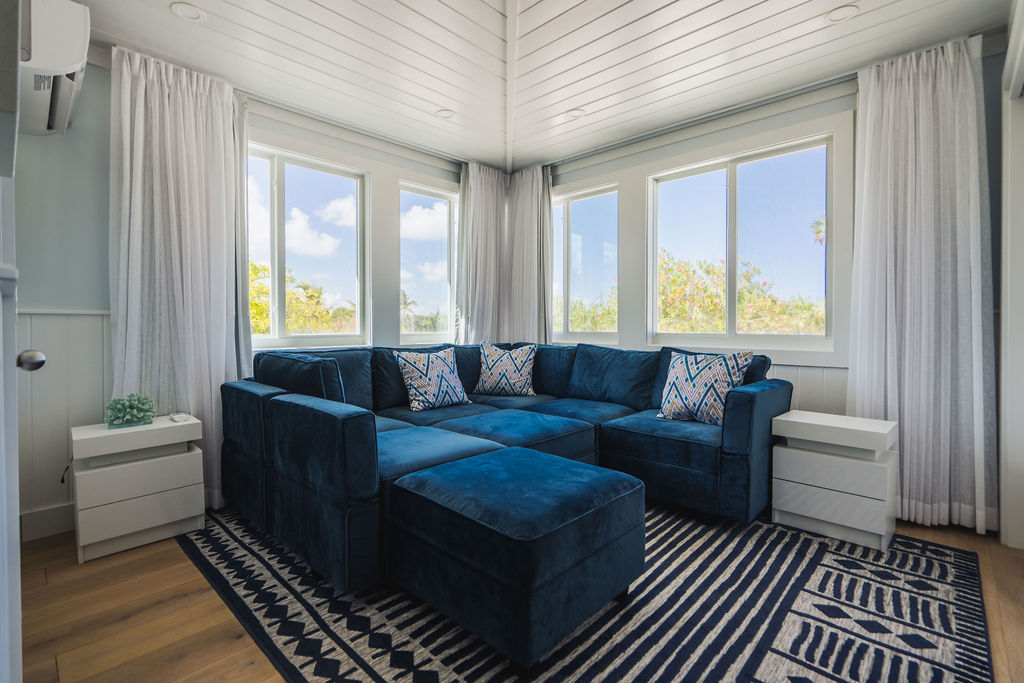 Living room with an ocean view at a luxury beachfront property at The Abaco Club