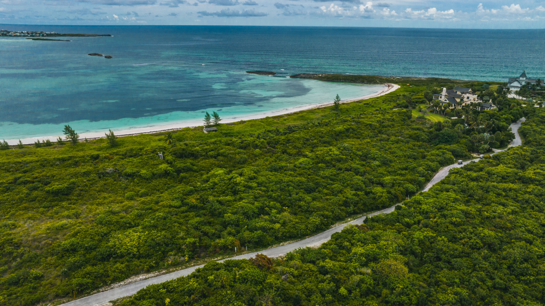 Scenic coastal landscape at The Abaco Club, showcasing serene living by the golf club