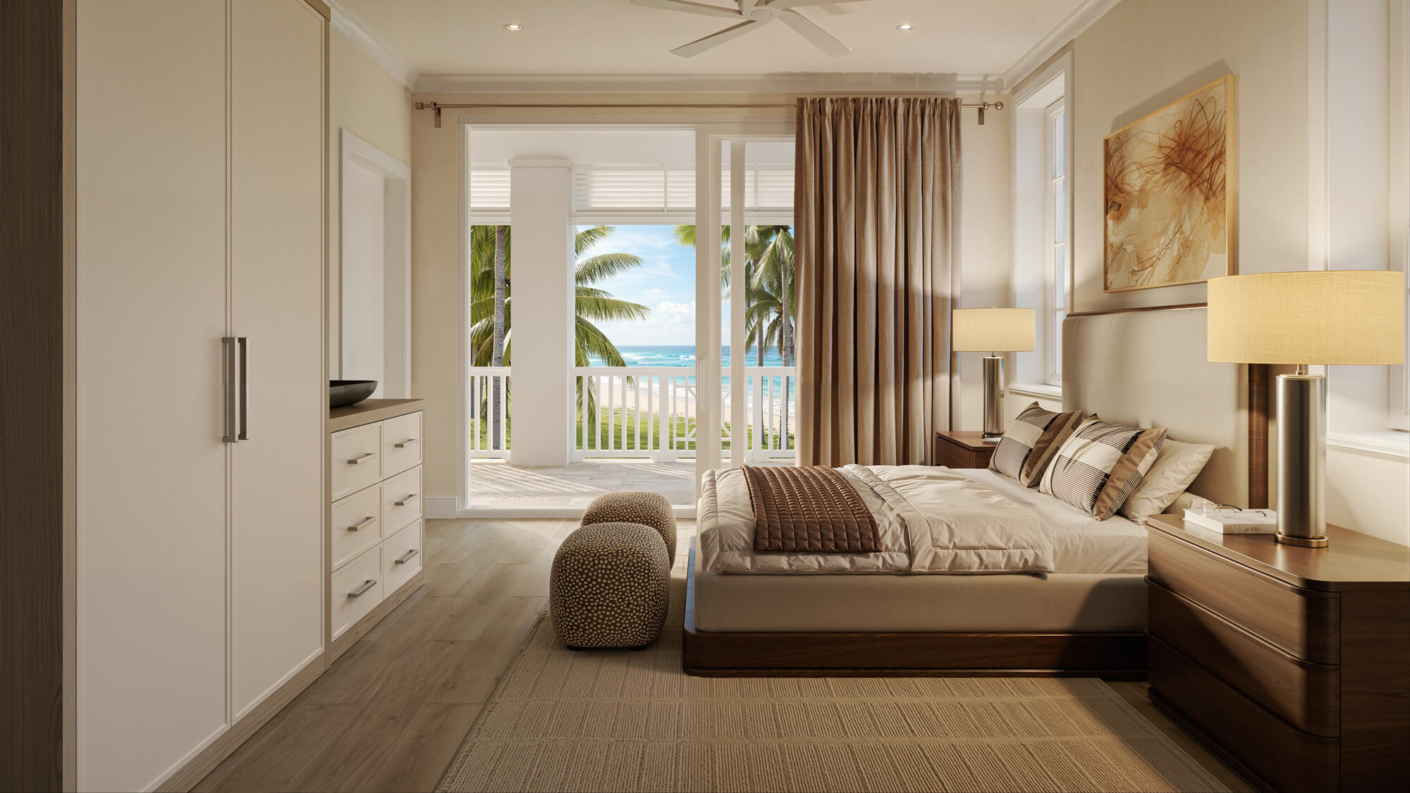 Hotel-style bedroom with a large bed, matching nightstands and warm lamps, opening to a balcony with palm trees and ocean view