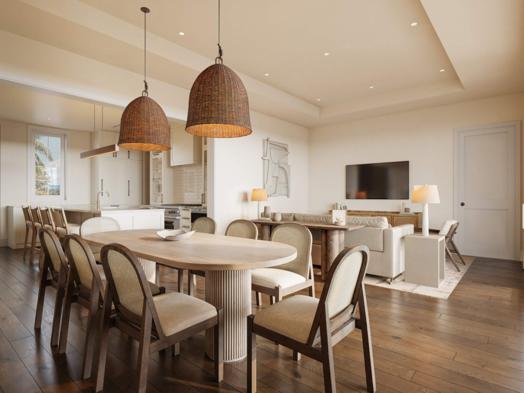 Open-concept dining area with a large wooden table and wicker chairs, two woven pendant lights, and a visible kitchen in the background.